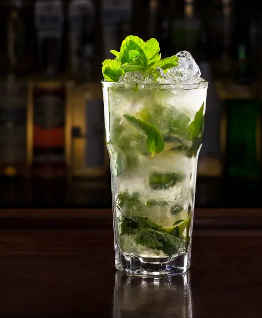 Refreshing mojito cocktail with fresh mint and crushed ice served at Osiris Club Stanmore bar.